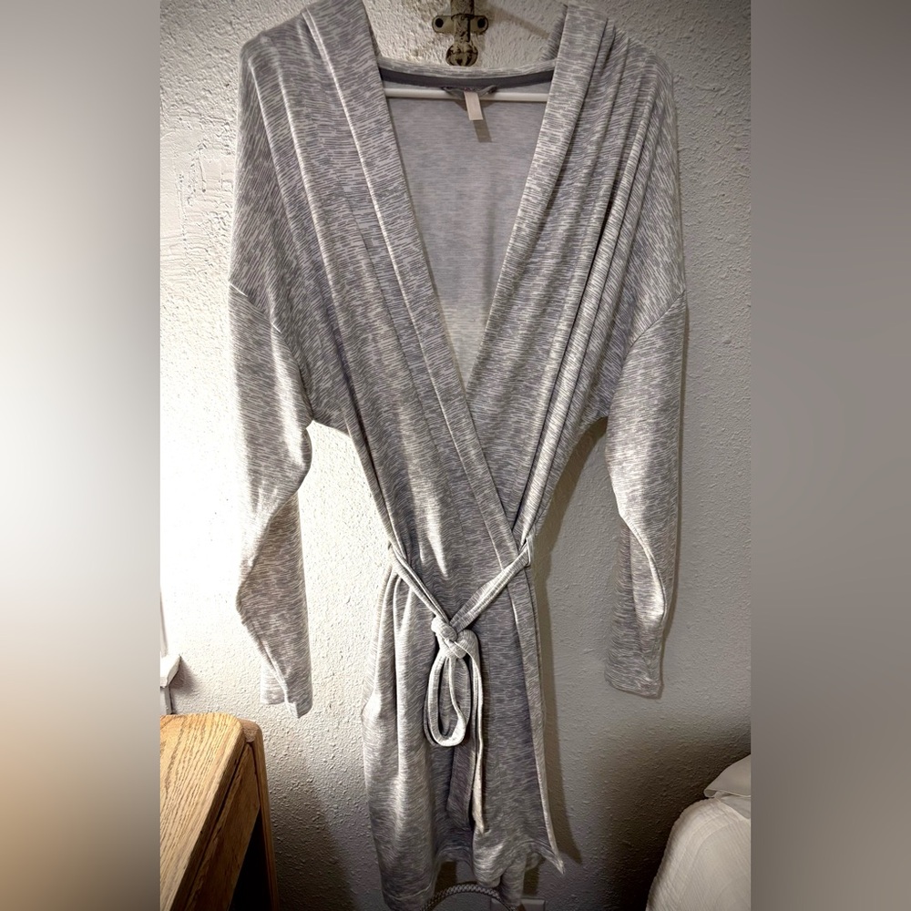 Light grey soft robe with pockets and a hood.